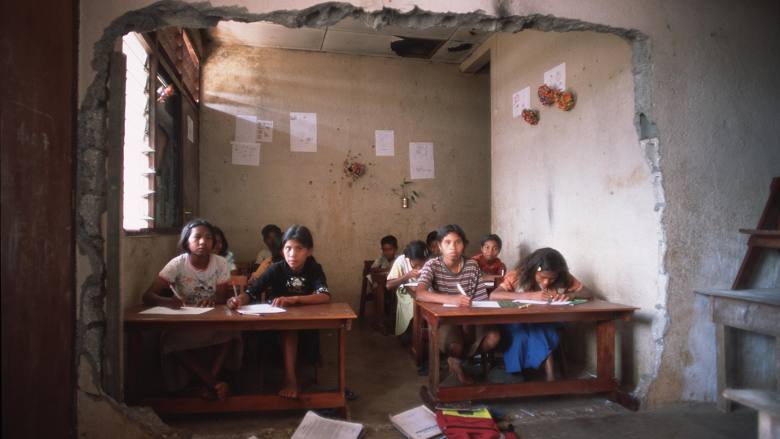 East Timor Student in a war torn classroom
